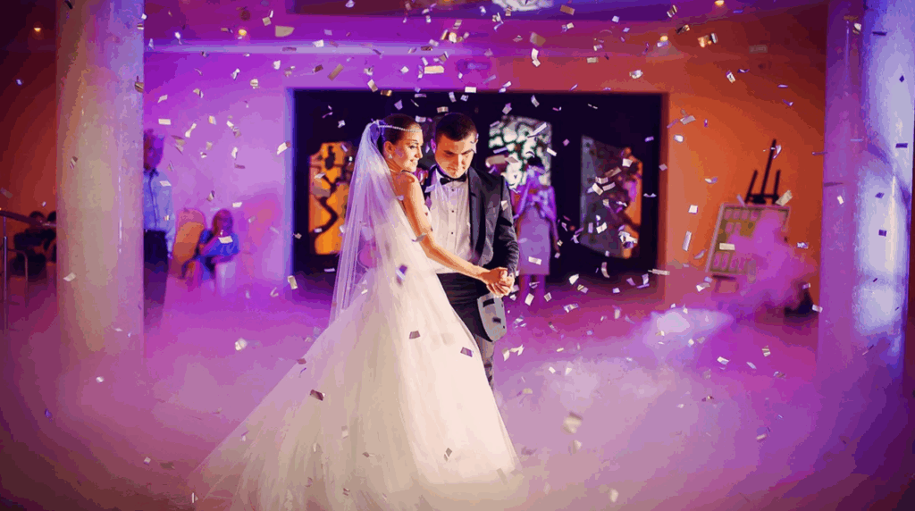 Azul Wedding Hall elegantly decorated for a reception, featuring white drapery, chandeliers, and a spacious dance floor.https://azulreceptionhall.com/event/wedding-reception/