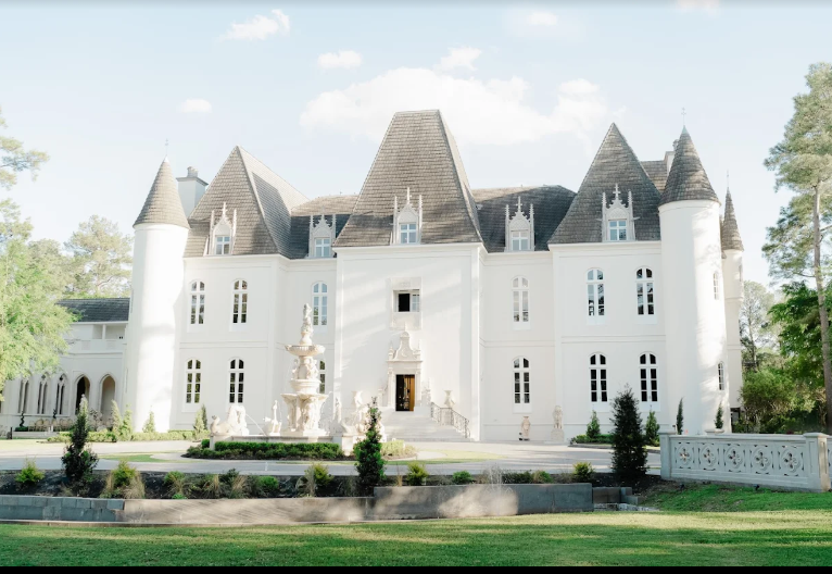 Château Nouvelle in Houston, Texas is a grand French-inspired estate with stone architecture, arched windows, and manicured gardens.