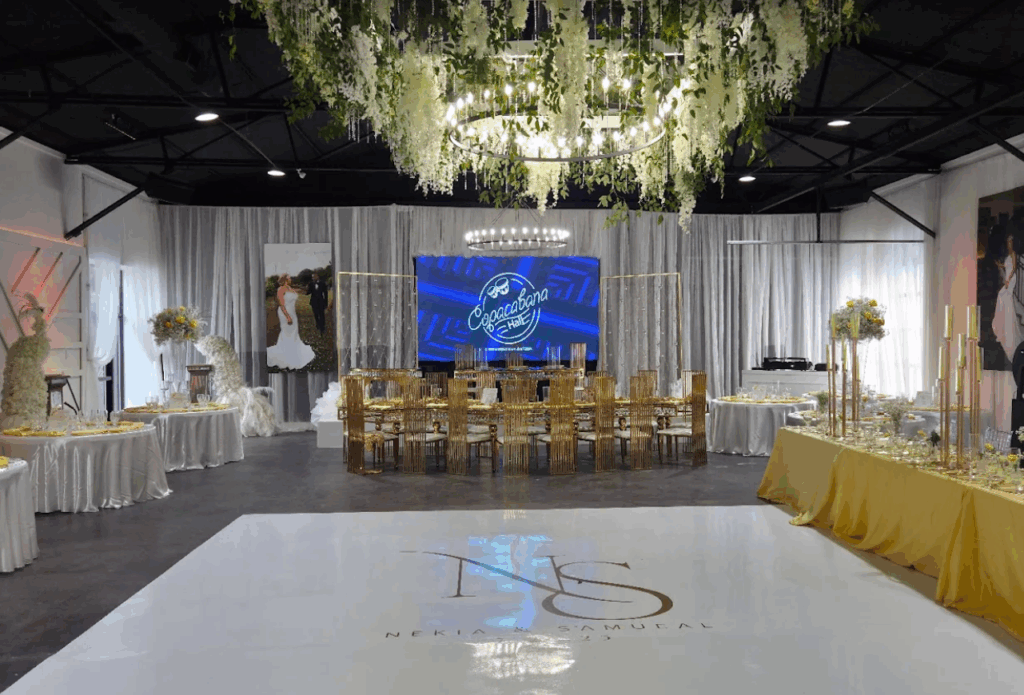 Interior view of Copacabana Hall in Houston, Texas, a large event venue with elegant lighting and spacious entrance for weddings and celebrations.