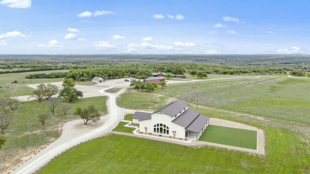 Aerial view of Diamond A Ranch wedding venue, showing the full property including rustic barns, open fields, and surrounding scenic countryside.
