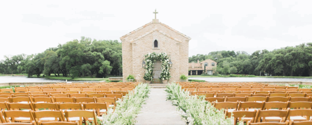 Scenic view of The Clubs at Houston Oaks wedding venue featuring oak trees, manicured lawns, and a serene outdoor ceremony space.