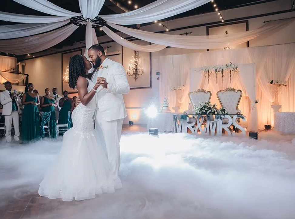 A bride and groom enjoy a first dance on the dance floor at the Pelazzio wedding hall in Houston, TX.