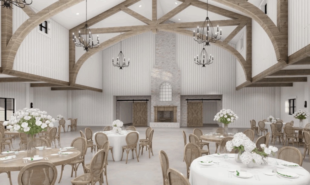Elegant interior of The Blue Magnolia in Houston, featuring soft blue and white décor, chandeliers, and natural light filling the reception hall.