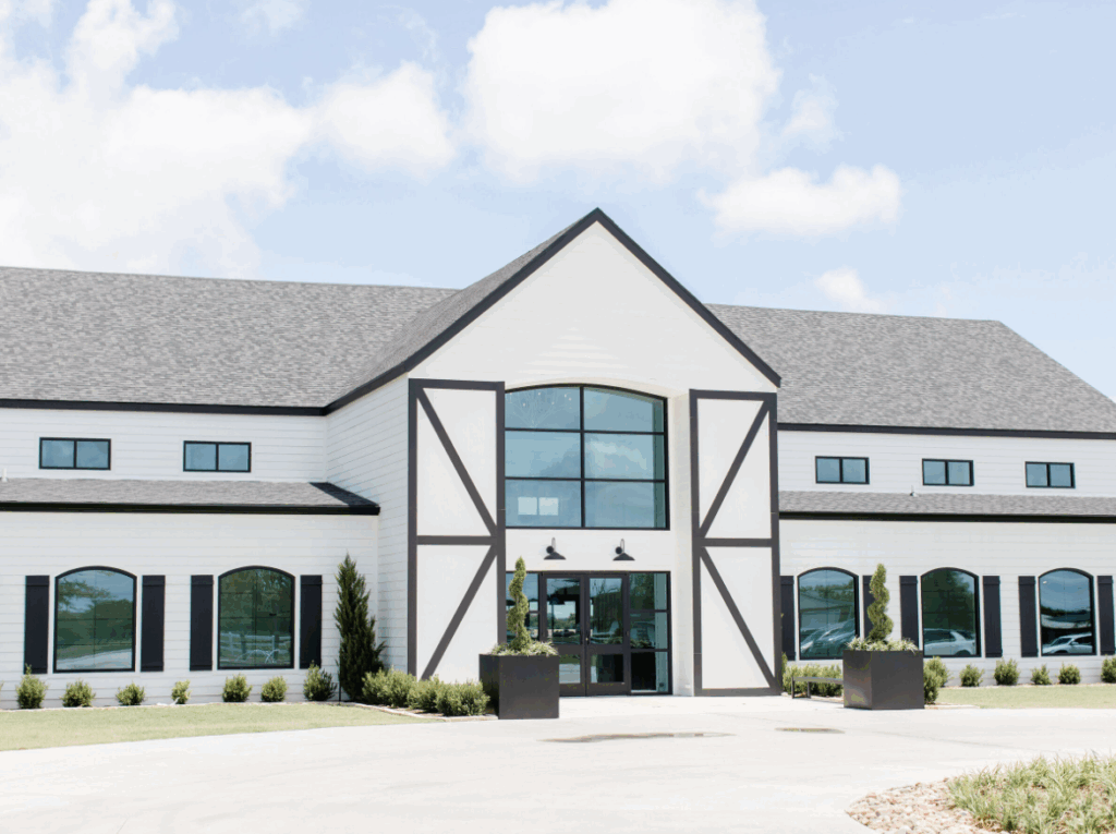 The Gardenia wedding venue near Dallas, Texas, featuring elegant white architecture, a grand chapel, and scenic countryside views.
