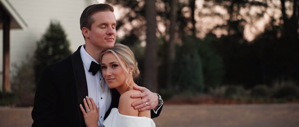 Bride and groom embracing just after their wedding ceremony in Dallas, Texas.